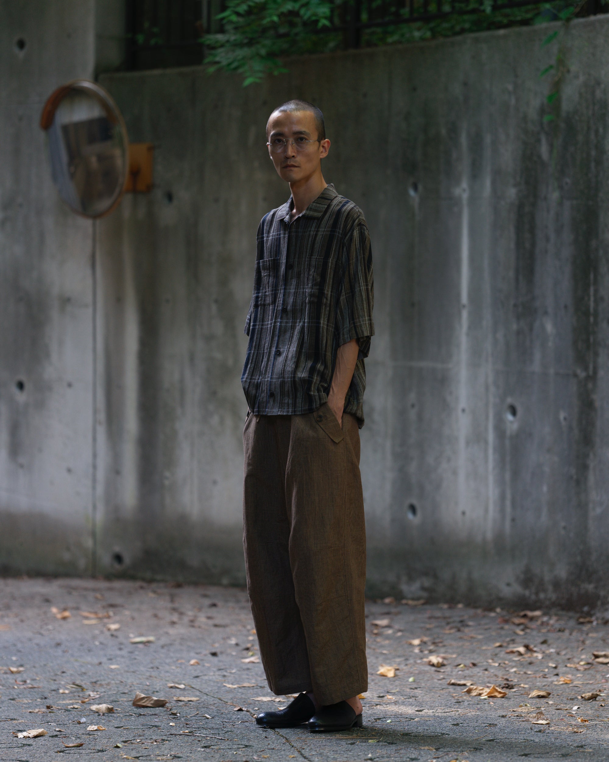Full-length styling with a dark striped short-sleeve shirt